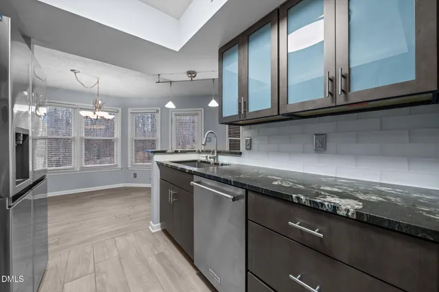 a kitchen with a sink and a stove