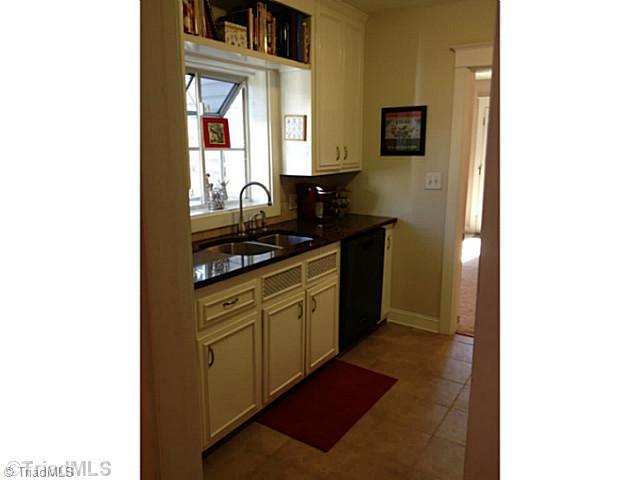 1701 Independence Road Greensboro, NC 27408 - Photo 5 of 15 Kitchen. Brand new tiled floor in this charming kitchen.