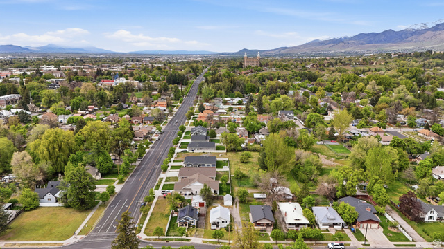 215 East 300 South Logan, UT 84321 - Photo 28 of 32 Aerial perspective of suburban area with a mountain backdrop