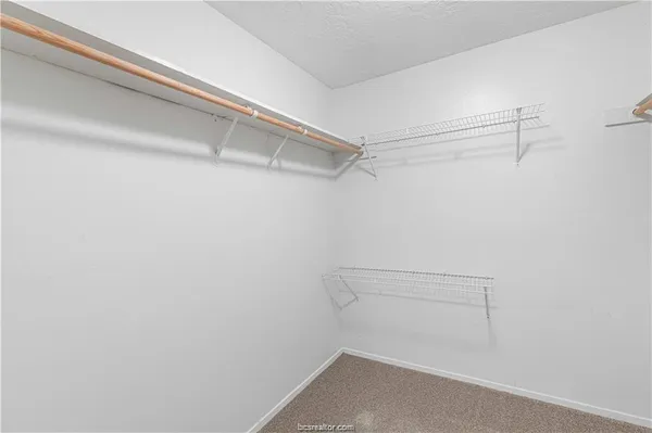 a view of a room with racks on the wall