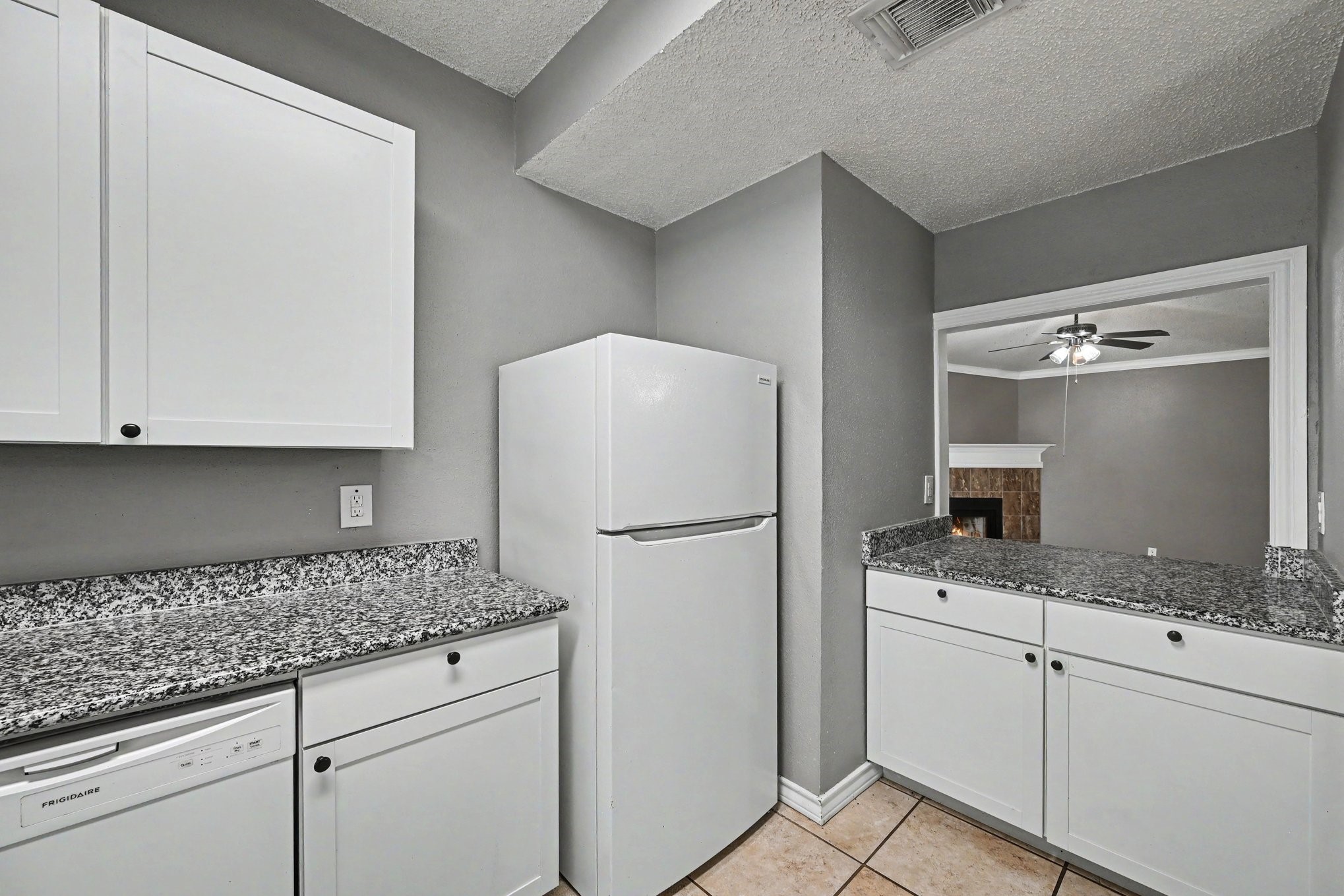 8406 Forest Ridge Drive San Antonio, TX 78239 - Photo 13 of 33 a white refrigerator freezer sitting inside of a kitchen