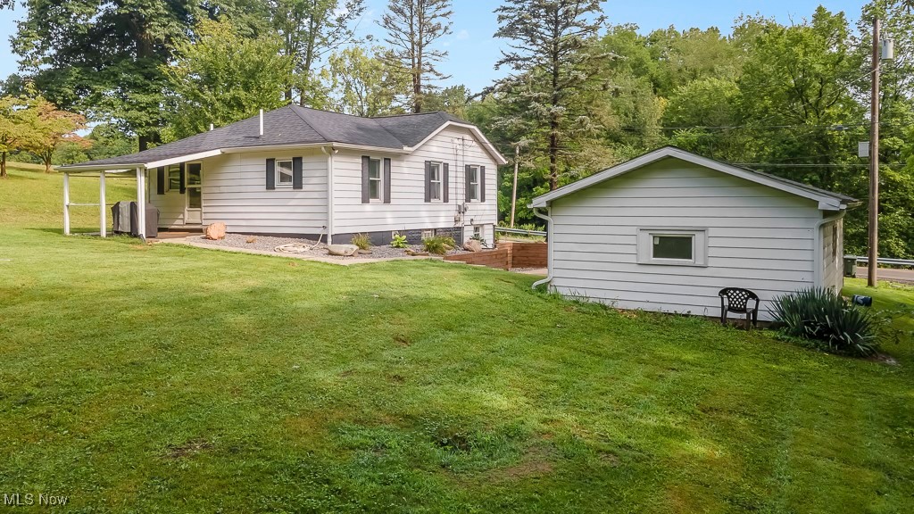 282 Johnson Road Wadsworth, OH 44281 - Photo 49 of 50 Back of house featuring a lawn