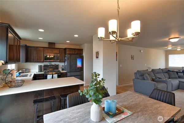 a kitchen with a table and chairs in it