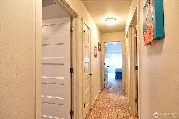 a view of a bathroom from a corridor
