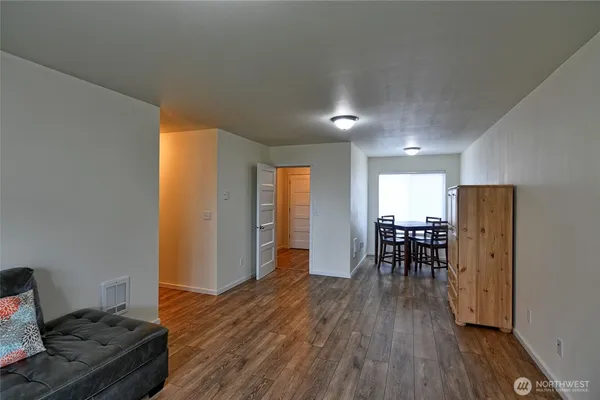 a view of a livingroom with furniture and wooden floor