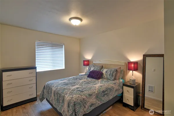 a bedroom with a bed and a closet