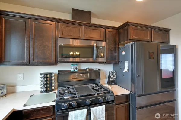 a kitchen with a stove and a microwave