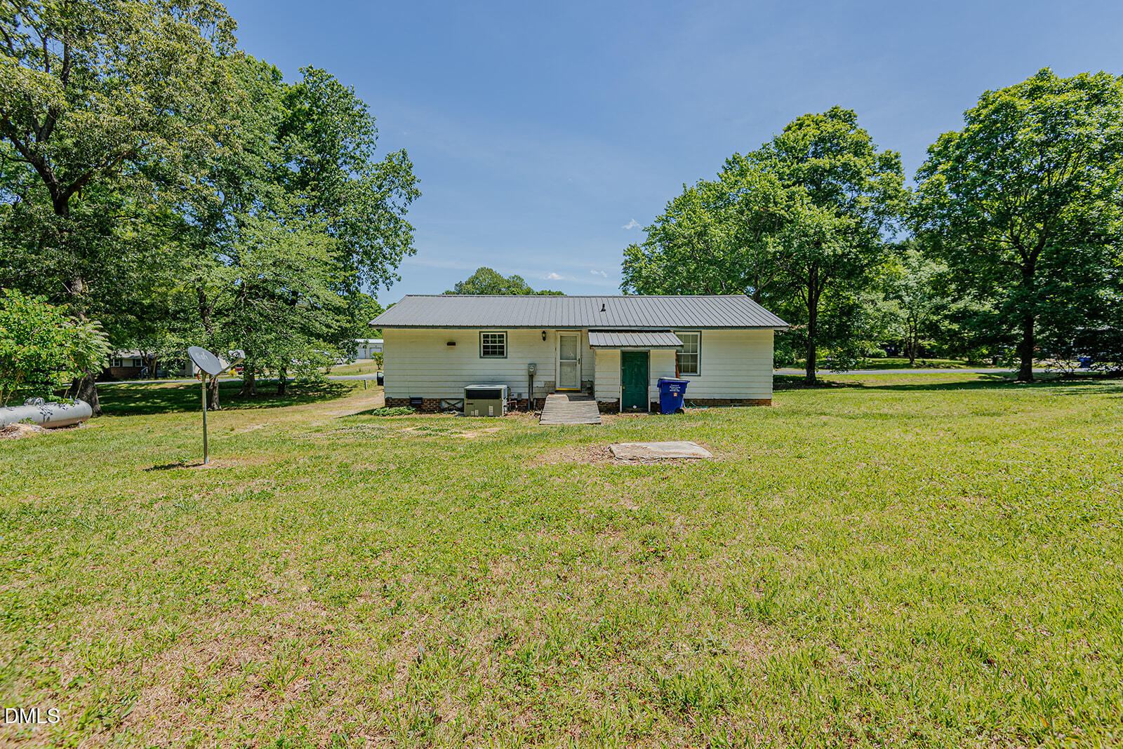 1302 Blacksmith Road Efland, NC 27243 - Photo 33 of 46 a front view of a house with yard and green space