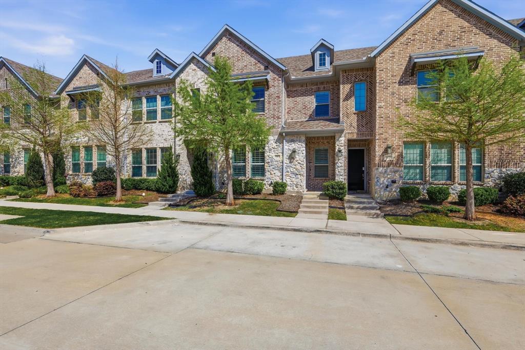 1567 Windermere Way Dallas, TX 75234 - Photo 1 of 26 front view of a brick house with a yard