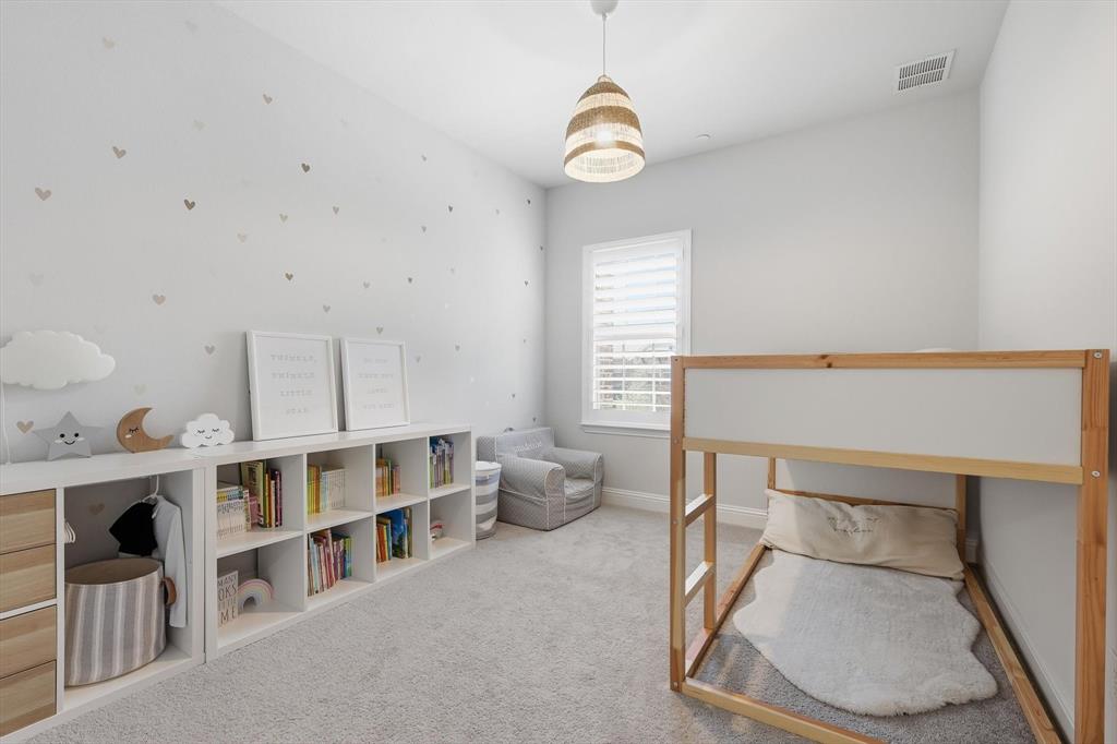 1567 Windermere Way Dallas, TX 75234 - Photo 18 of 26 a bedroom with furniture and natural light