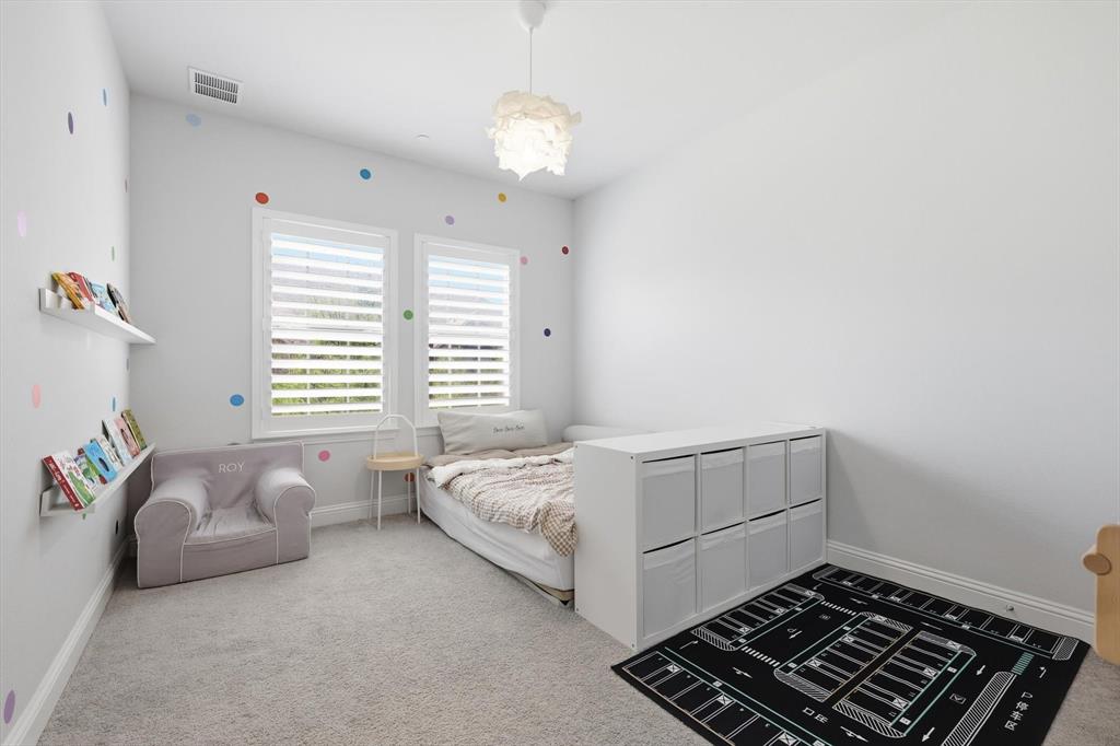 1567 Windermere Way Dallas, TX 75234 - Photo 20 of 26 a room with bed and a window