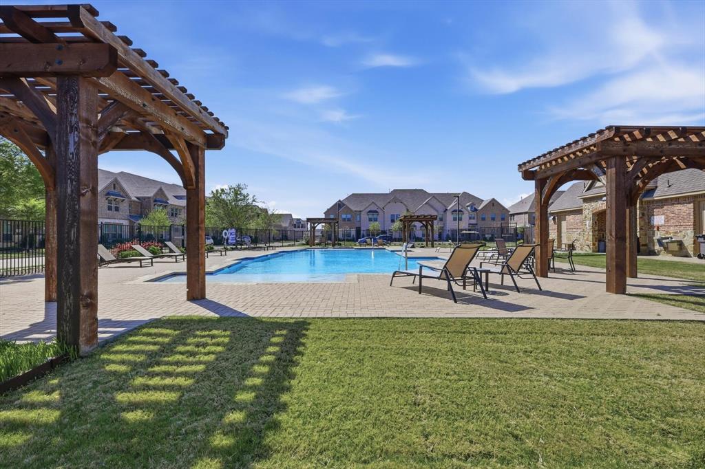 1567 Windermere Way Dallas, TX 75234 - Photo 23 of 26 a swimming pool with outdoor seating and yard