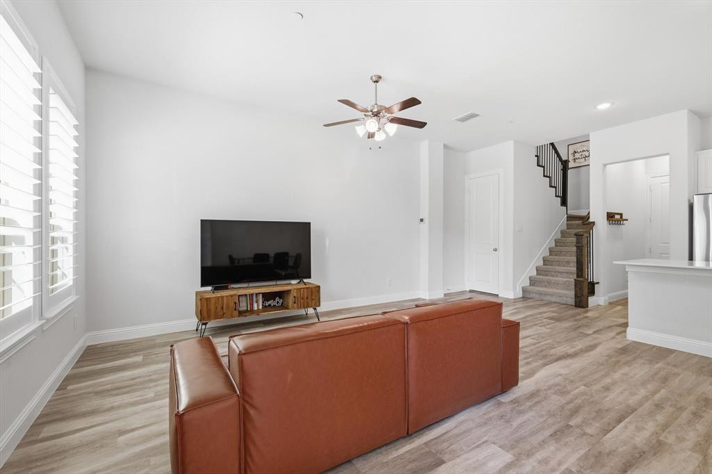 1567 Windermere Way Dallas, TX 75234 - Photo 3 of 26 a living room with furniture and a flat screen tv