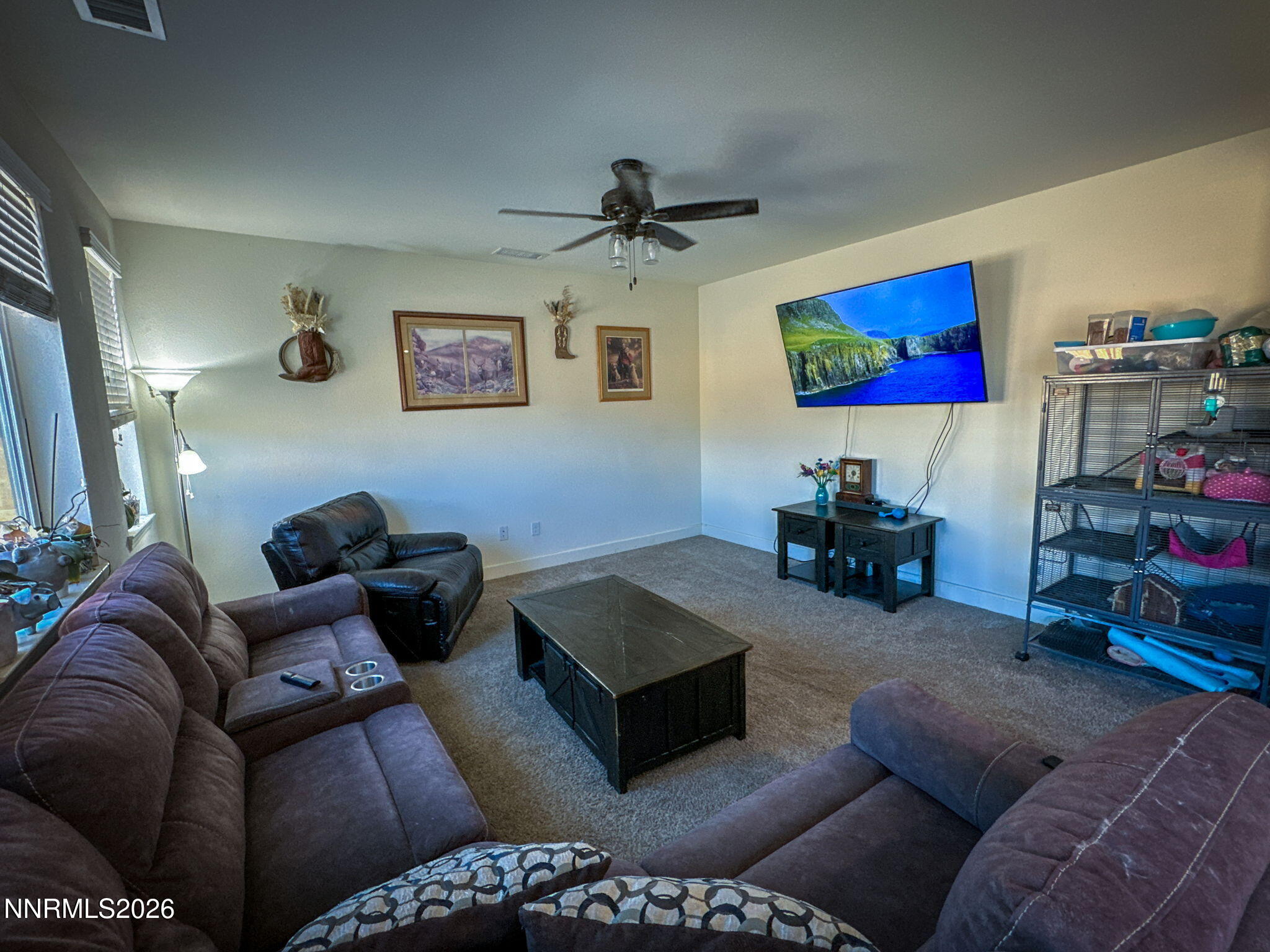 7330 Overture Drive Reno, NV 89506 - Photo 5 of 17 a living room with furniture and a flat screen tv
