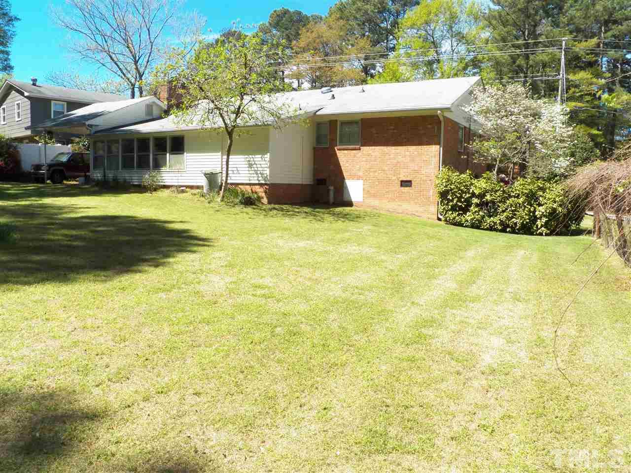 132 East Rowan Street Raleigh, NC 27609 - Photo 21 of 24 a view of a house with pool and yard