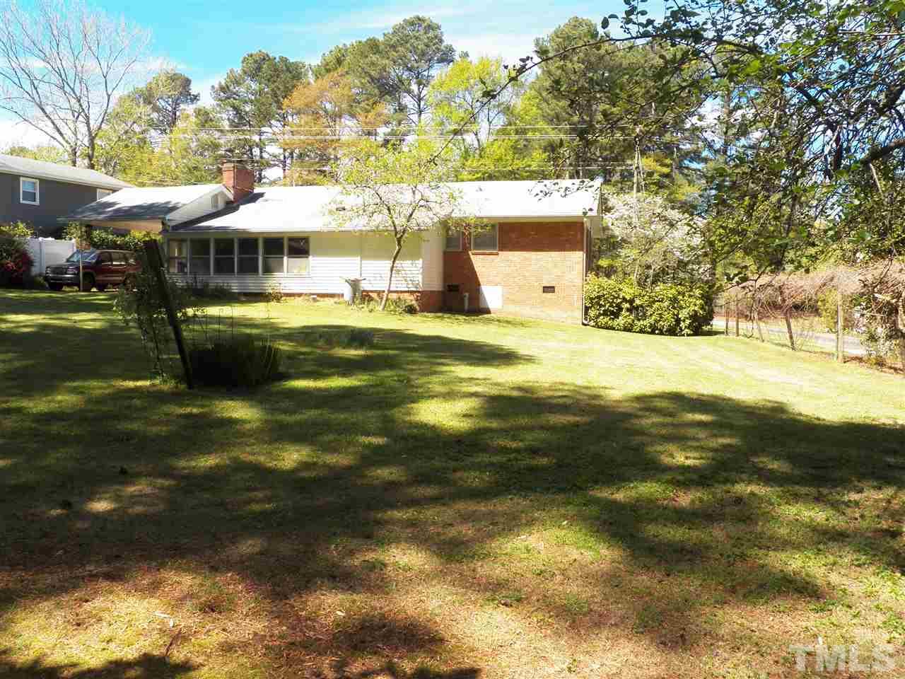 132 East Rowan Street Raleigh, NC 27609 - Photo 22 of 24 a front view of a house with a garden