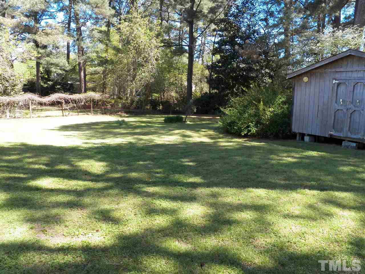 132 East Rowan Street Raleigh, NC 27609 - Photo 24 of 24 a view of a yard with a house