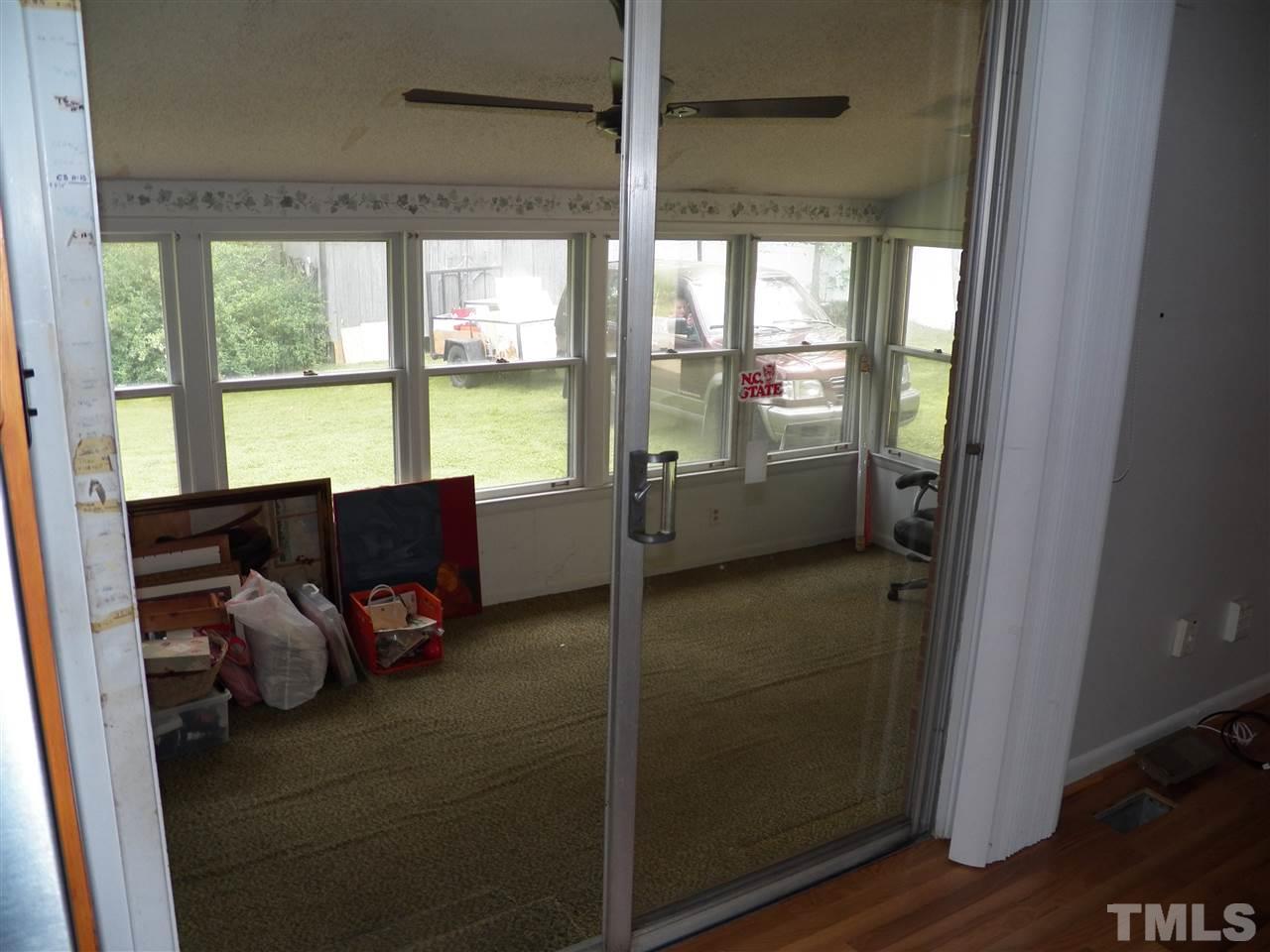 132 East Rowan Street Raleigh, NC 27609 - Photo 10 of 24 a living room with furniture and a floor to ceiling window