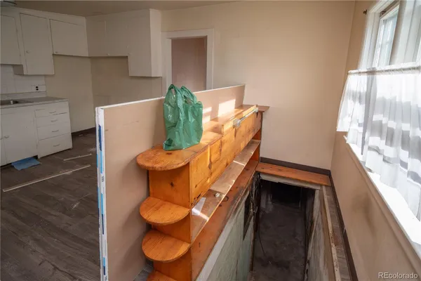 a view of kitchen and wooden floor