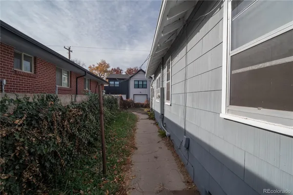 a view of a pathway both side of house