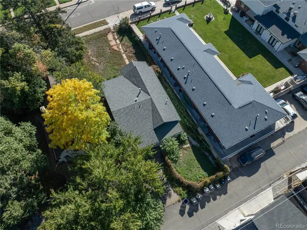 an aerial view of a residential houses with outdoor space