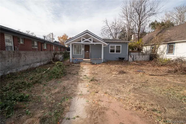 a front view of a house with yard