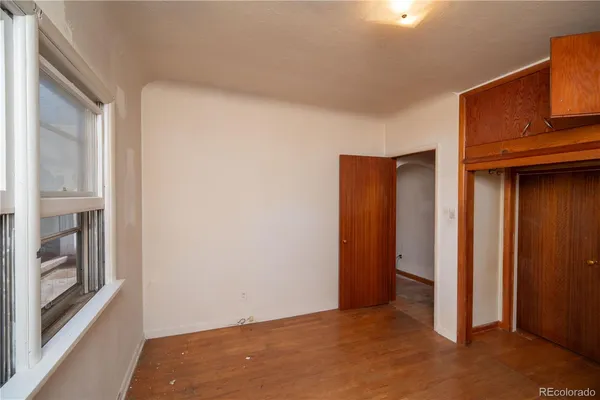 a view of an empty room with a fireplace