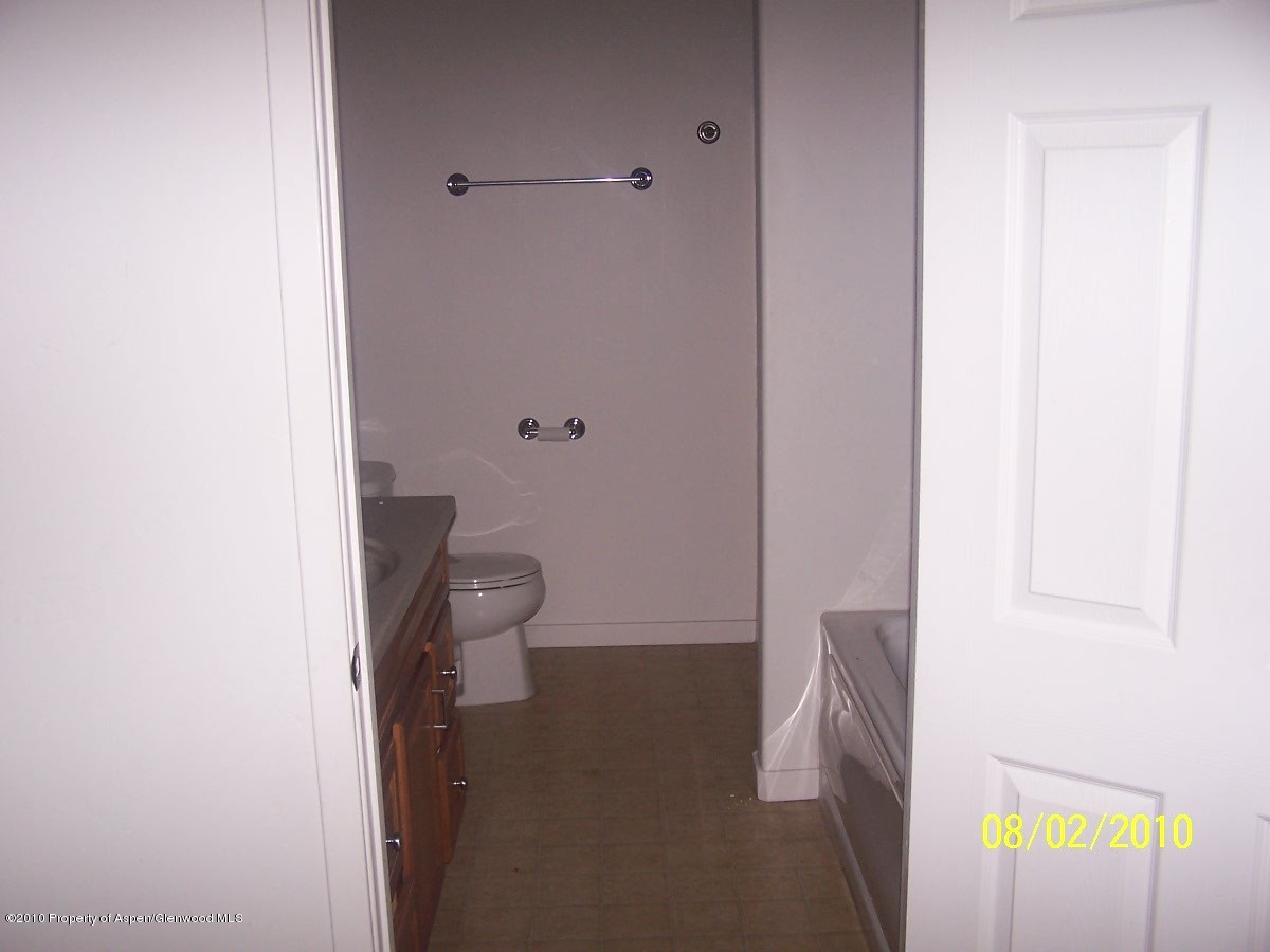861 East 18th Street Rifle, CO 81650 - Photo 11 of 17 a bathroom with a toilet and a shower