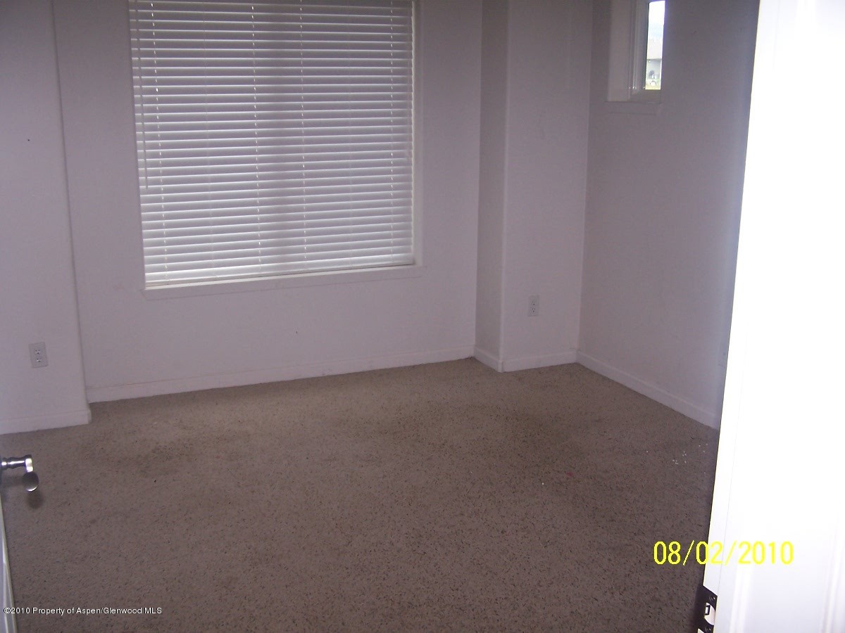 861 East 18th Street Rifle, CO 81650 - Photo 4 of 17 a view of an empty room with a window