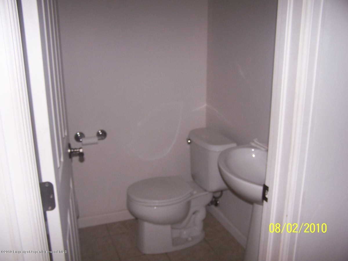 861 East 18th Street Rifle, CO 81650 - Photo 6 of 17 a white toilet sitting next to a shower