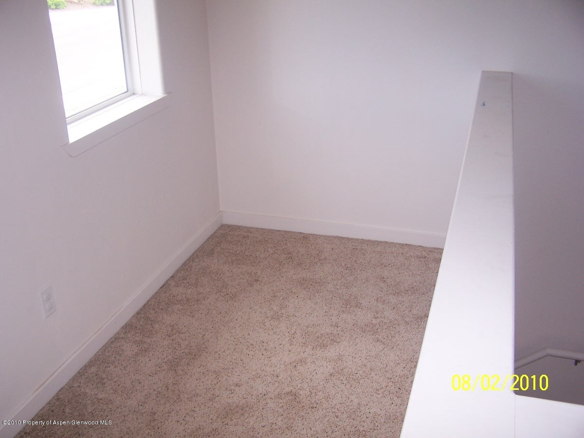 861 East 18th Street Rifle, CO 81650 - Photo 7 of 17 an empty room with a window