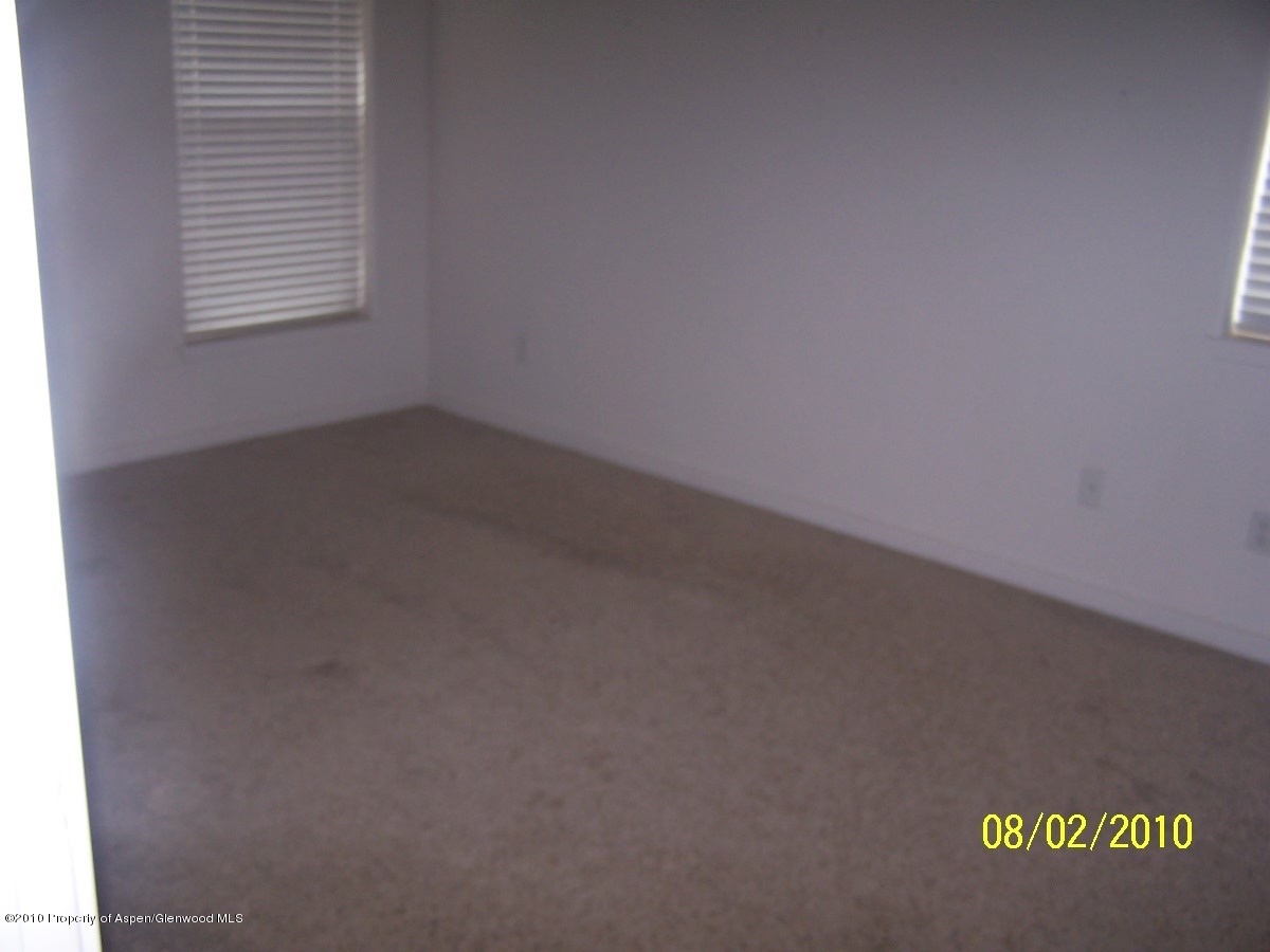 861 East 18th Street Rifle, CO 81650 - Photo 9 of 17 an empty room with a window