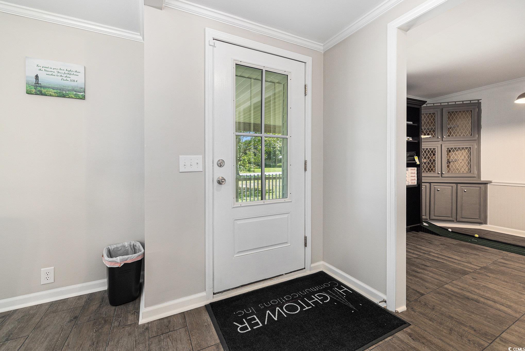 3843 Kelly Road Conway, SC 29526 - Photo 5 of 40 Doorway featuring dark wood-type flooring and crown molding