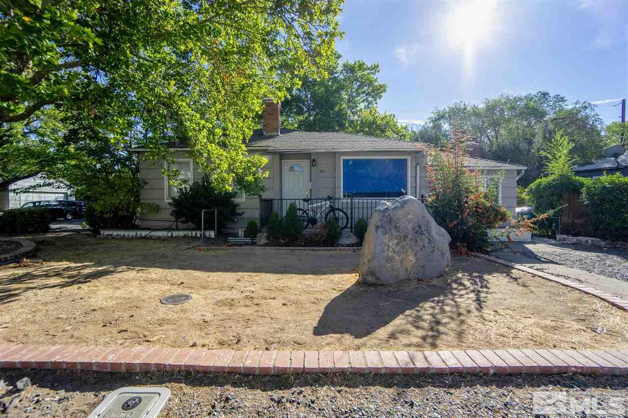 180 Bisby Street Reno, NV 89512 - Photo 1 of 13 a view of a backyard with large trees