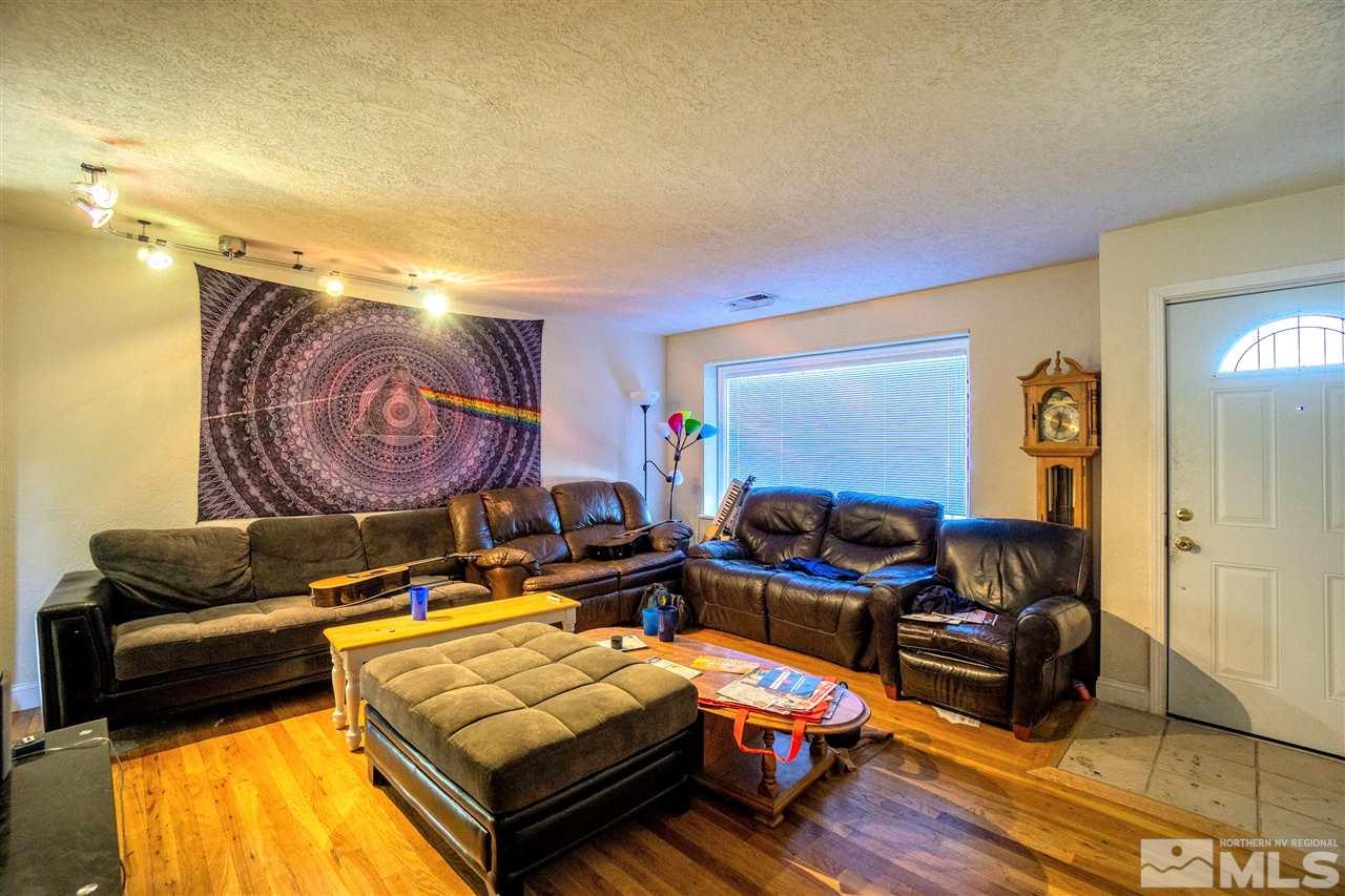 180 Bisby Street Reno, NV 89512 - Photo 3 of 13 a living room with furniture and a lamp