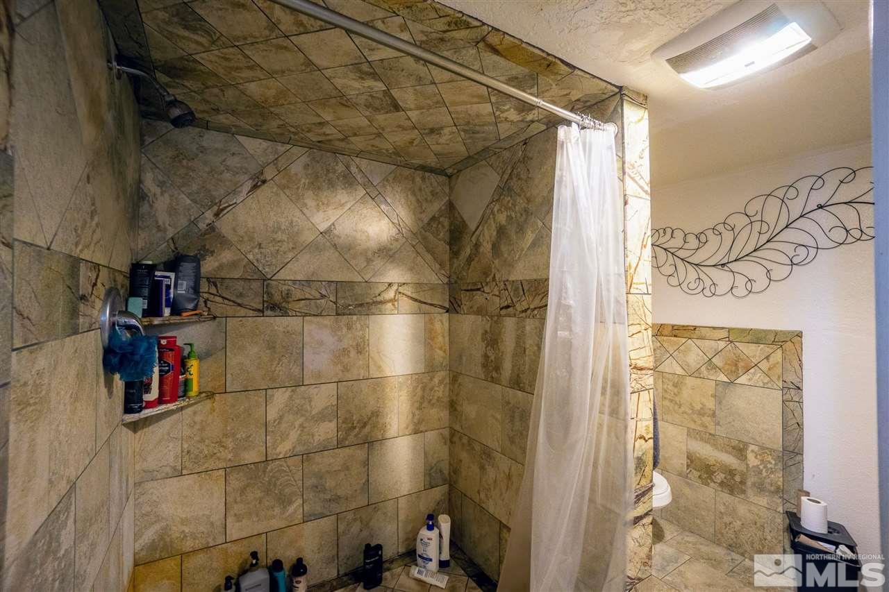 180 Bisby Street Reno, NV 89512 - Photo 8 of 13 a bathroom with a shower