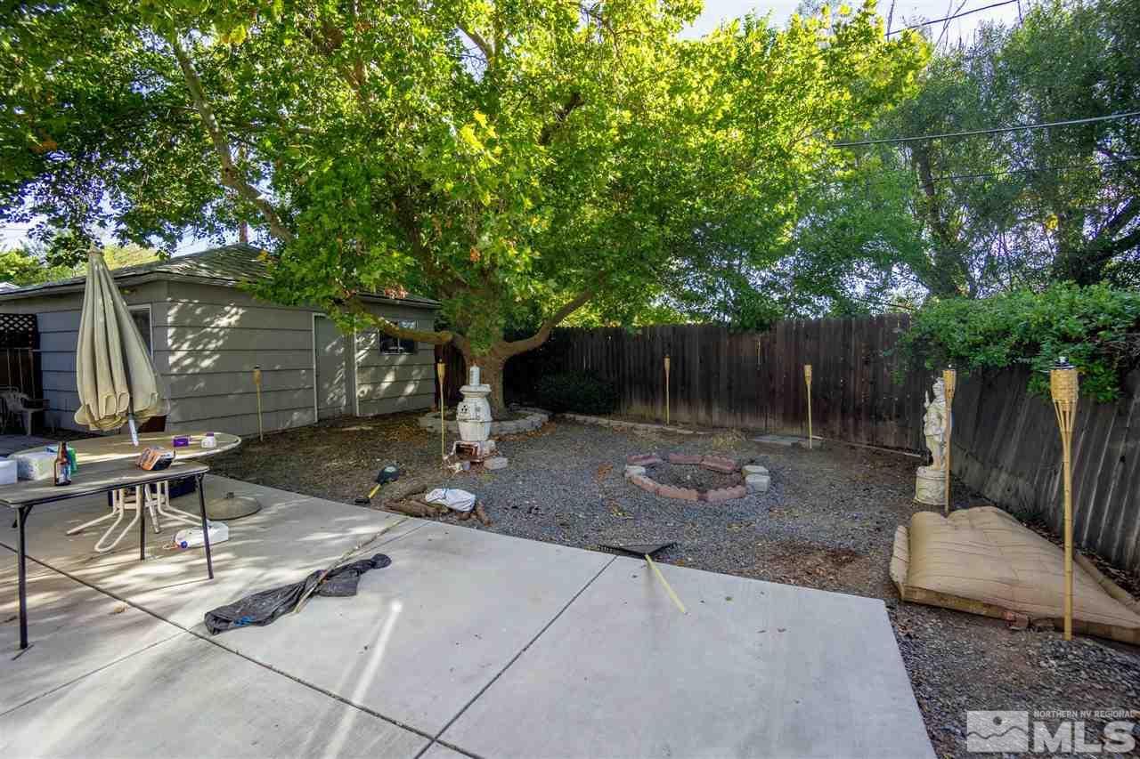 180 Bisby Street Reno, NV 89512 - Photo 10 of 13 a view of a chairs and table in a backyard