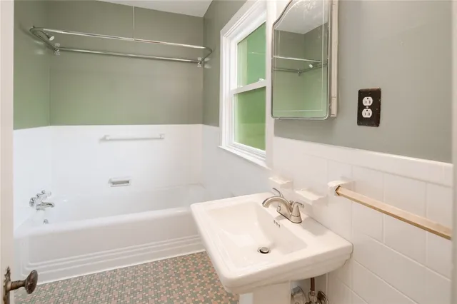 a bathroom with a sink and a bathtub