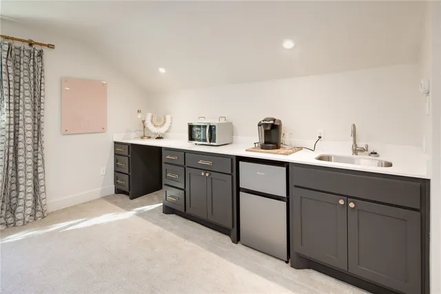 a kitchen with a sink and cabinets