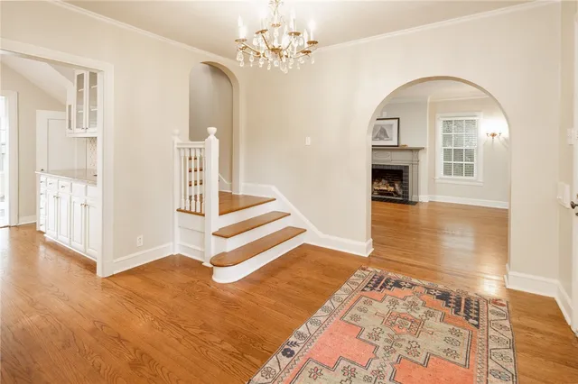 a view of an entryway with wooden floor