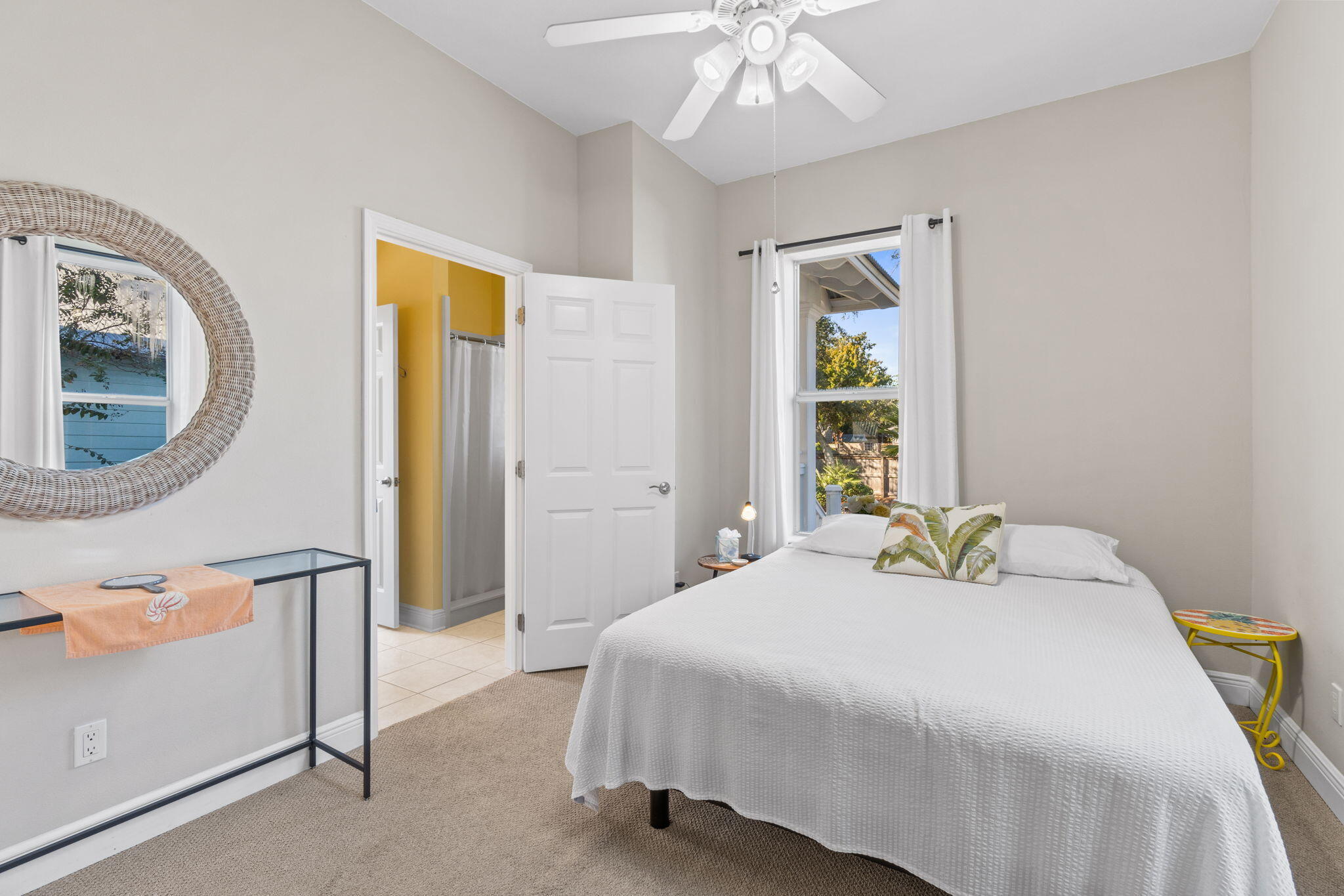 80 Dolphin Street Destin, FL 32541 - Photo 16 of 36 a bedroom with a bed and a chandelier