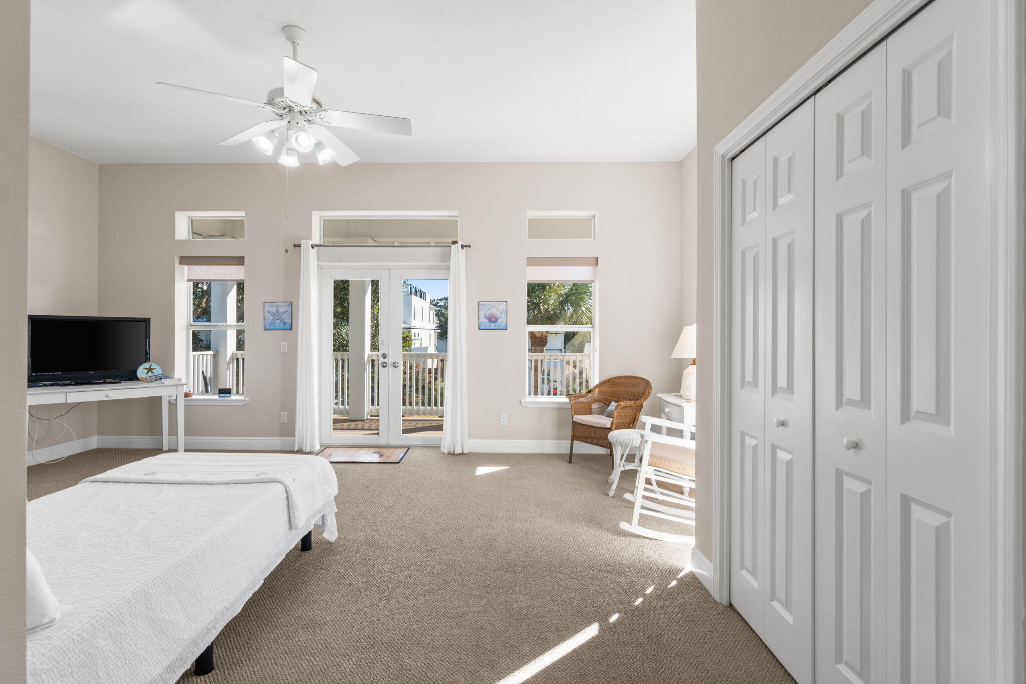 80 Dolphin Street Destin, FL 32541 - Photo 22 of 36 a bedroom with furniture and a flat screen tv