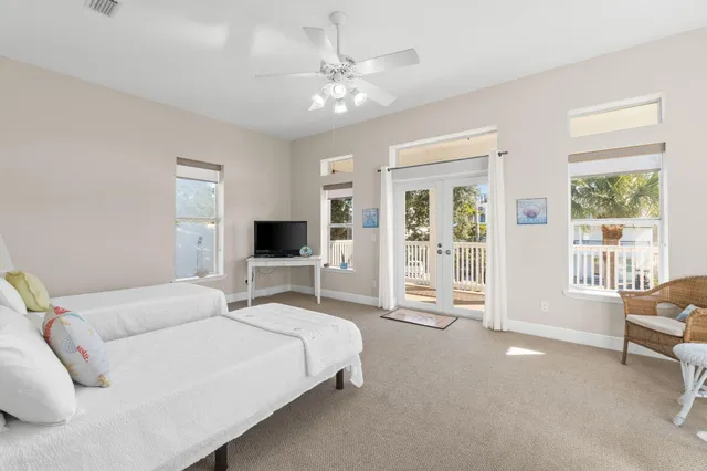 a living room with furniture a fireplace and a window