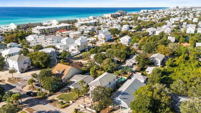 a view of a swimming pool with a patio and a garden