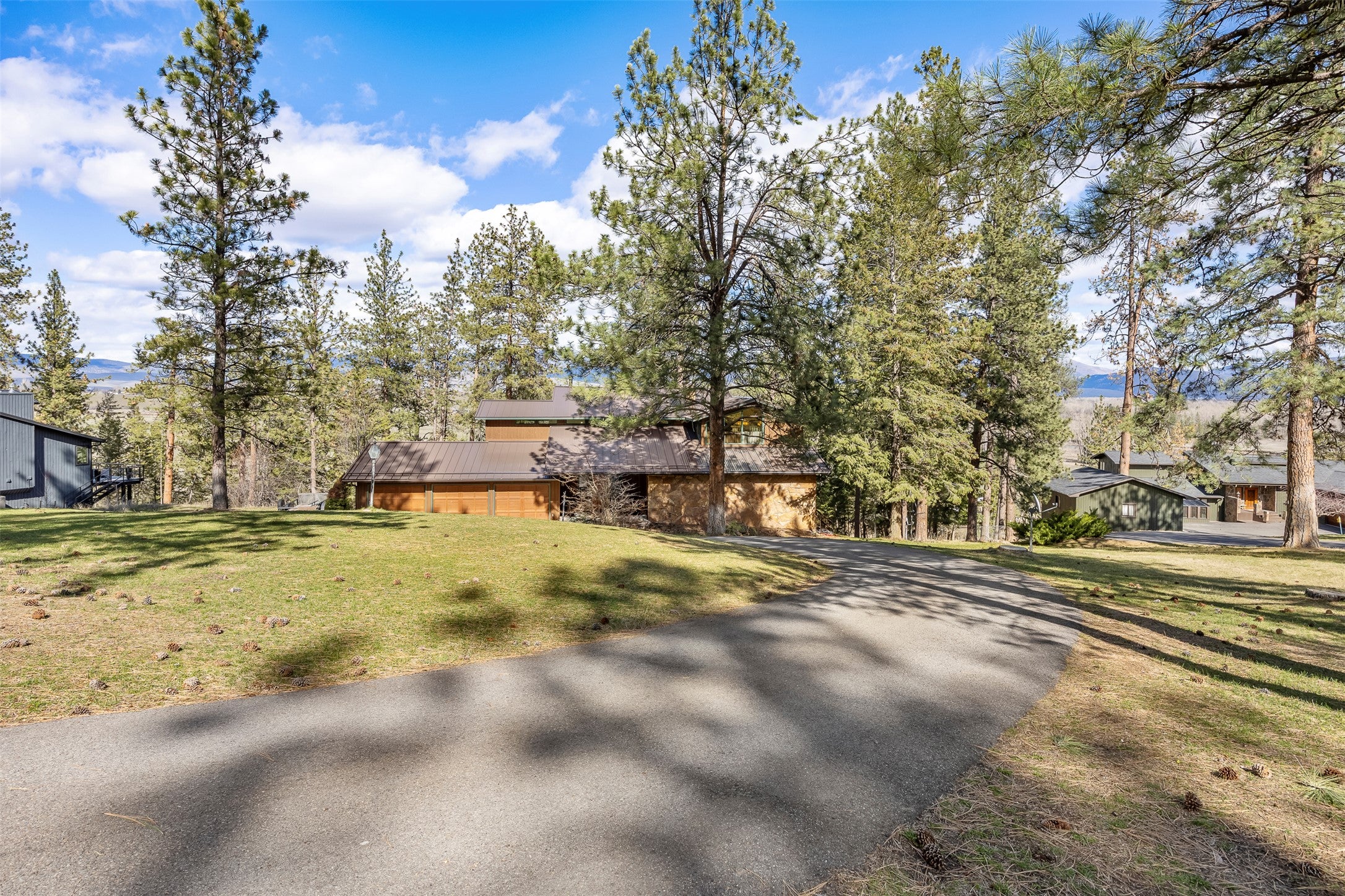 730 Big Flat Road Missoula, MT 59804 - Photo 1 of 59 View of front of property featuring driveway and a front lawn
