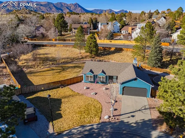 an aerial view of a house with a ocean view