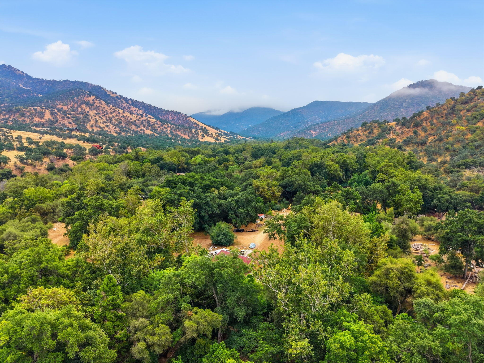44065 South Fork Drive Three Rivers, CA 93271 - Photo 29 of 33 a view of a lush green field with mountains in the background