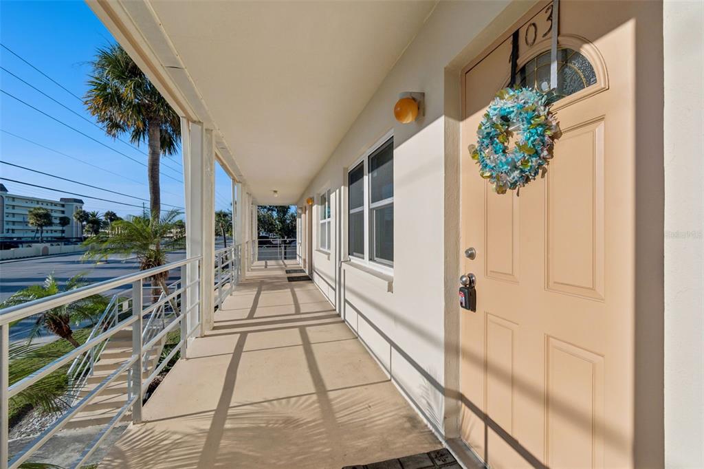 4565 Duhme Road, Unit 203 St. Petersburg, FL 33708 - Photo 2 of 27 a view of balcony with wooden floor