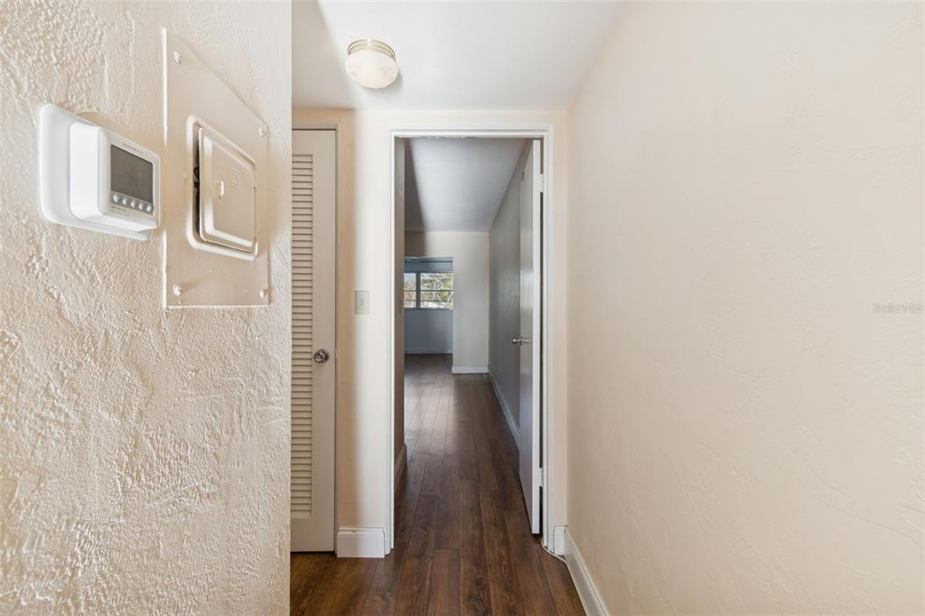 4565 Duhme Road, Unit 203 St. Petersburg, FL 33708 - Photo 10 of 27 a view of a hallway with wooden floor