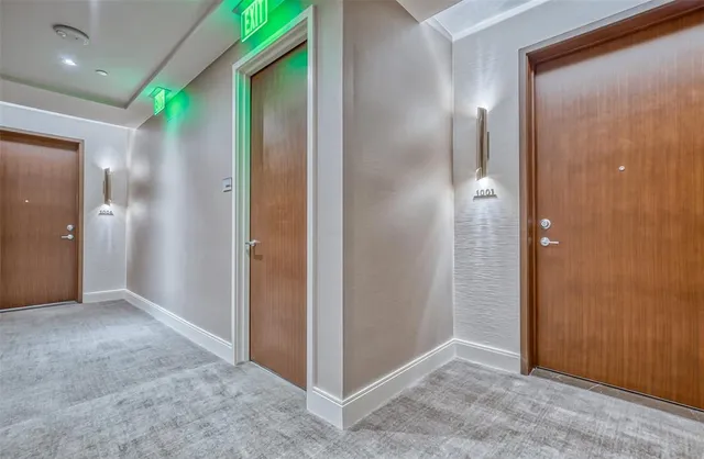 an empty room with closet and a bathroom